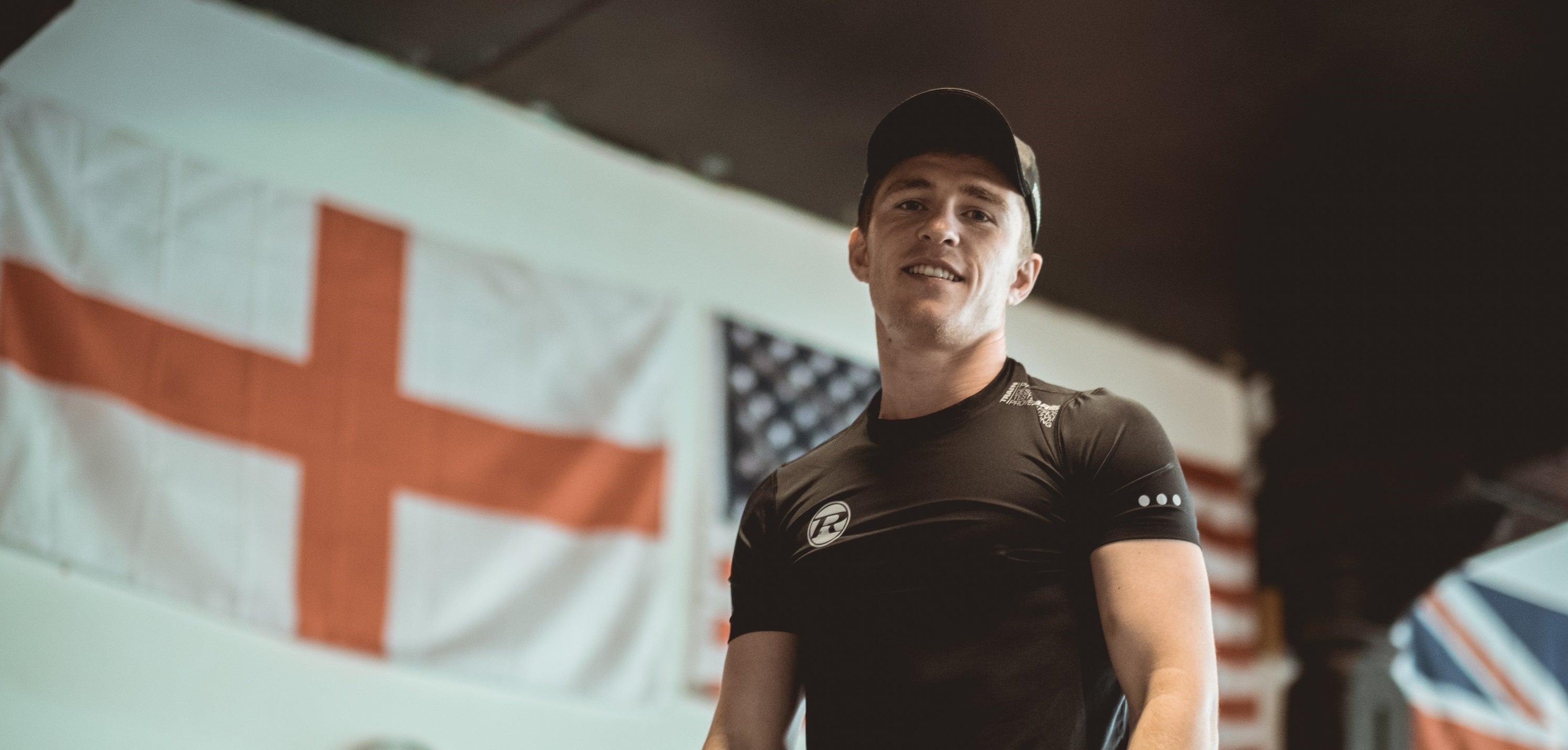 Boxer wearing Ringside apparel standing in front of British flags